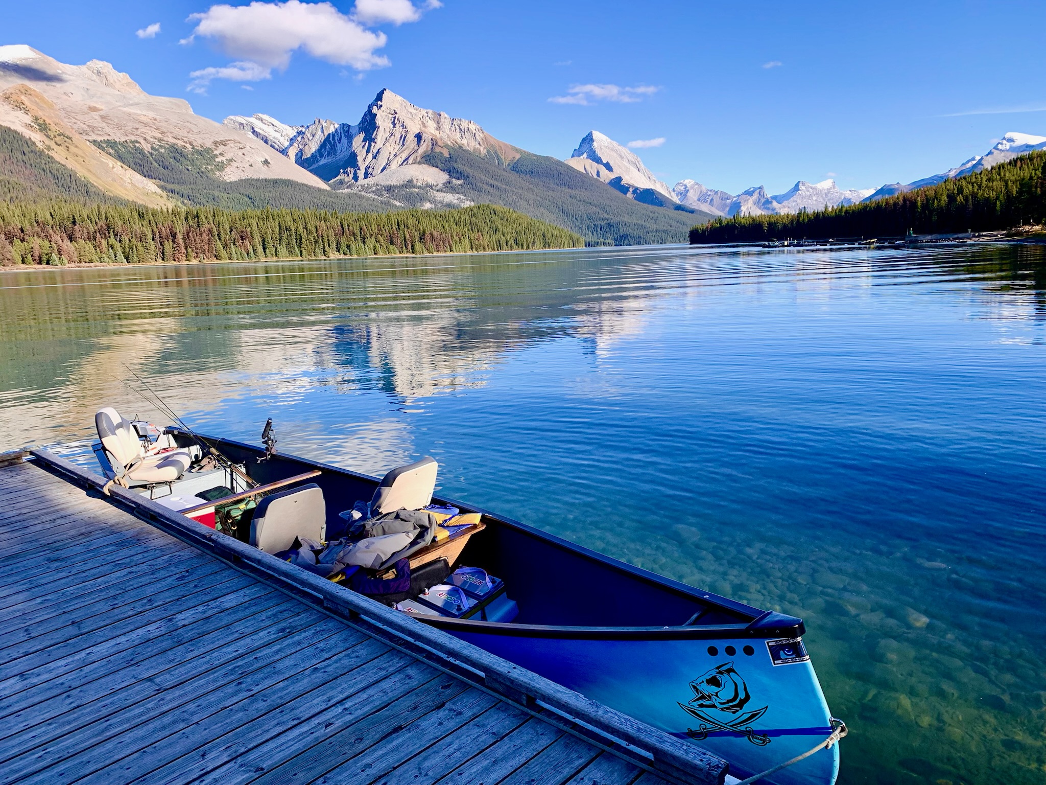 Blue freighter canoe at Maligne Lake dock, Rocky Mountains, Jasper National Park