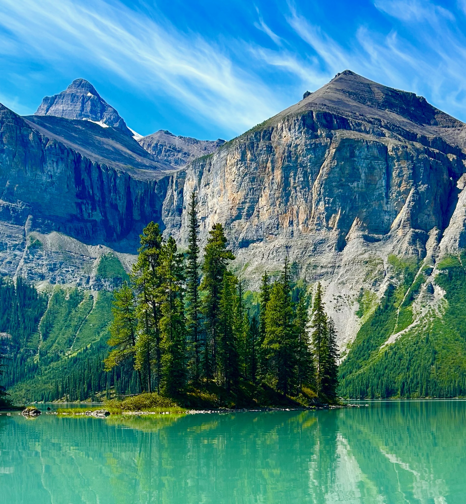 Mountain peaks reflected in Maligne Lake, Jasper National Park