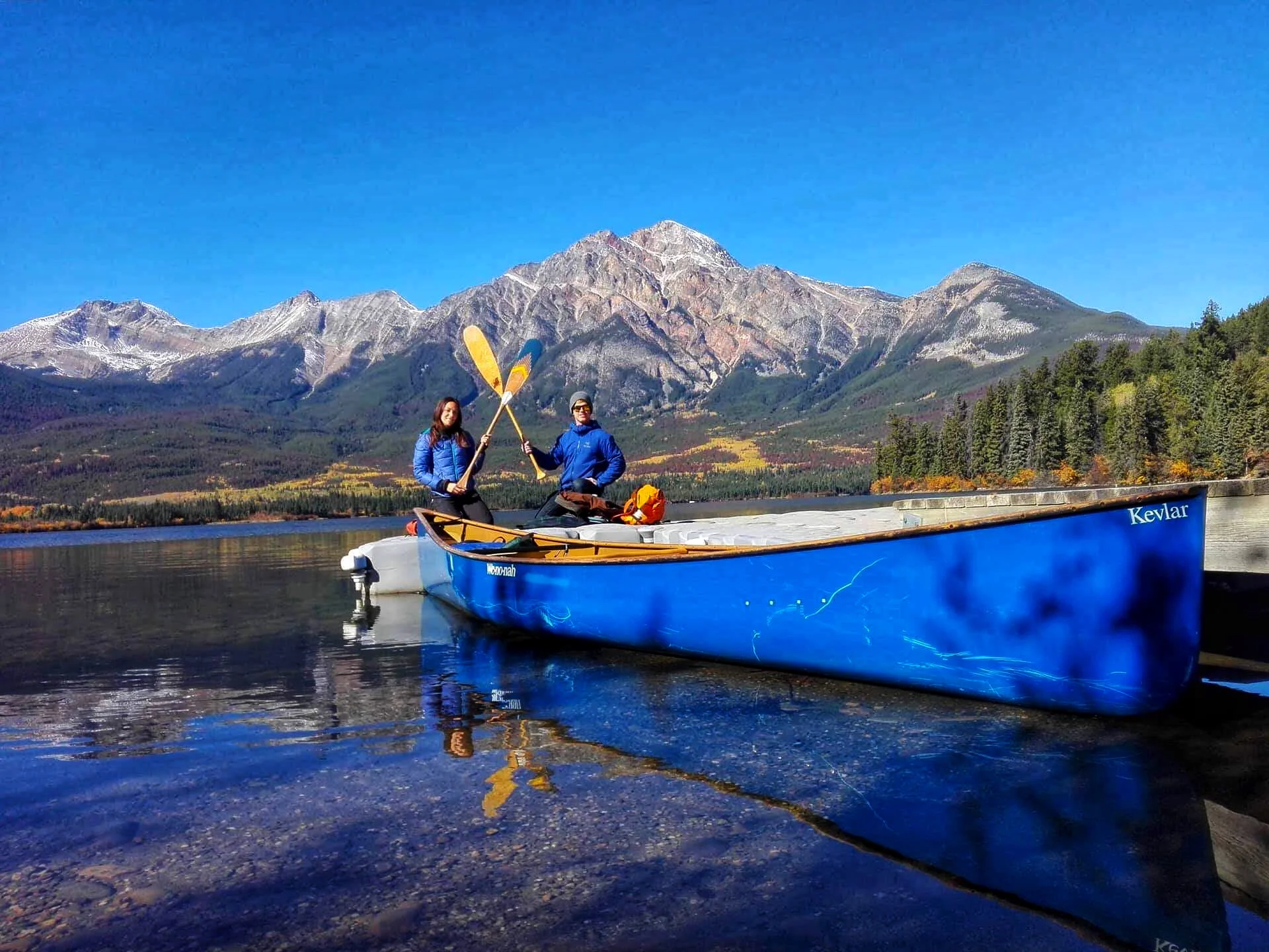 Couple in blue canoe on Pyramid Lake, Jasper National Park