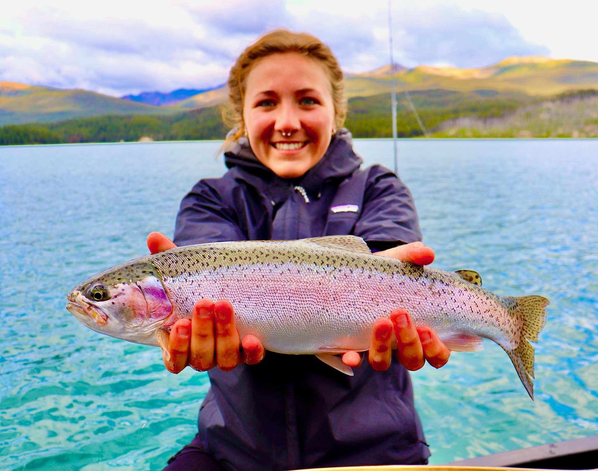 Rainbow trout held up on Maligne Lake guided fishing trip, Jasper