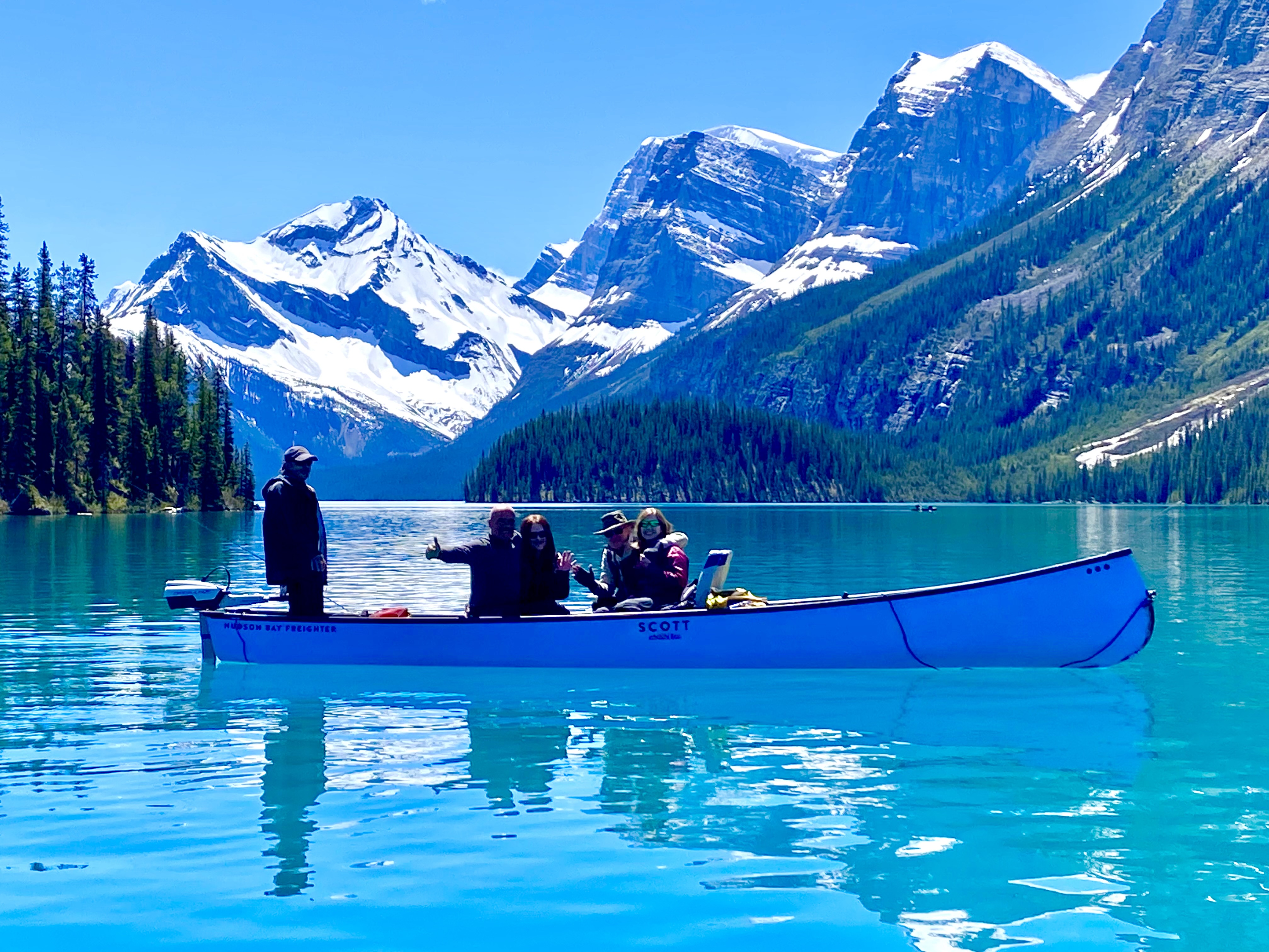 Freighter canoe with guests in the Hall of the Gods, Maligne Lake